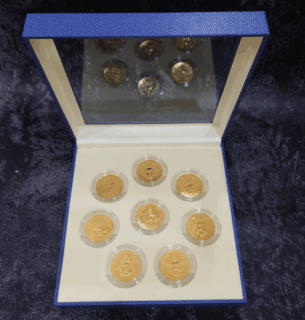 A set of 8 commemorative coins, 8 days of birth, made of cupronickel, gold plated, packed in a leather box with a certificate from the Treasury Department.