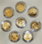 A set of 8 commemorative coins, 8 days of birth, made of cupronickel, gold plated, packed in a leather box with a certificate from the Treasury Department. - Image 4