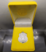 A polished silver coin of the King sitting on the throne, commemorating the 50th anniversary of the King's accession to the throne, created by the Ministry of Interior in 1996, with original box.